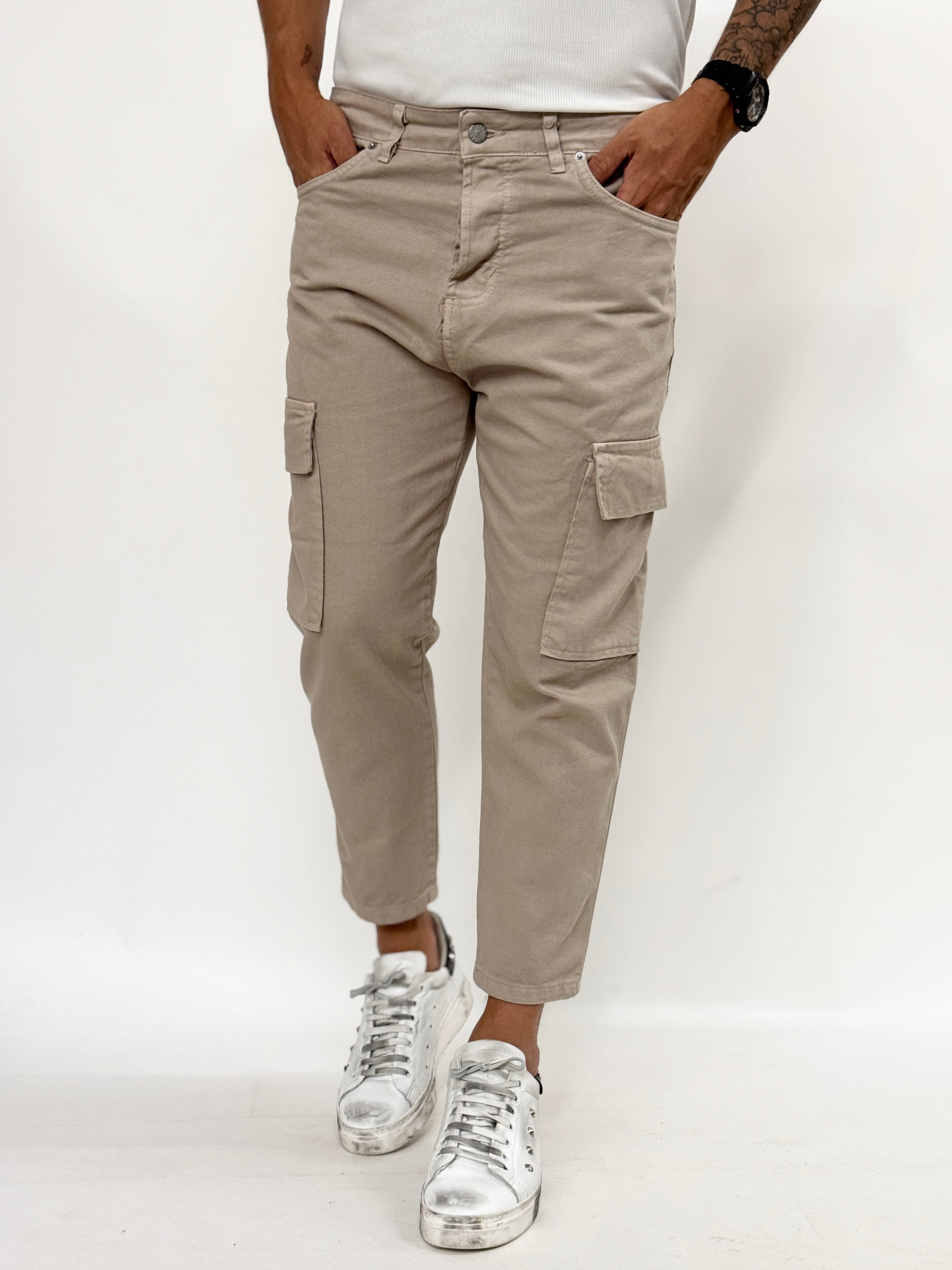 Beige carrot fit cargo jeans for men by Malkutha Store, featuring multiple pockets and a relaxed silhouette.