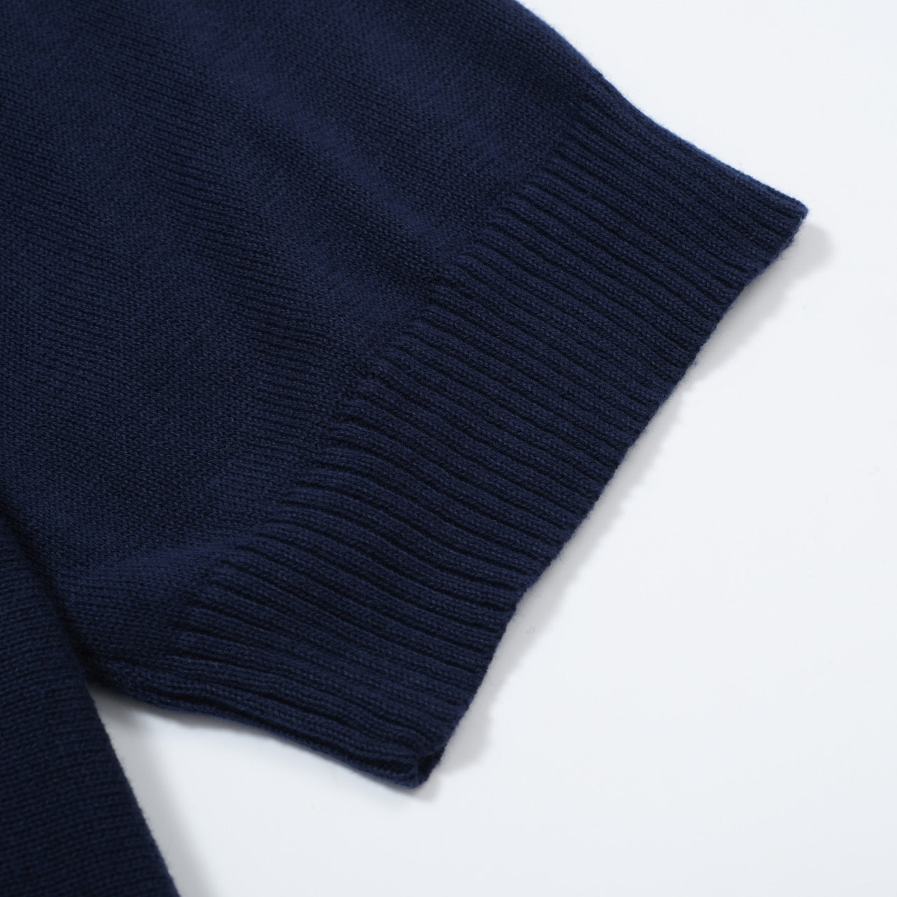 Men's OXKNIT navy and sky blue vertical stripe knit polo shirt with button-up design. Retro 1960s style.