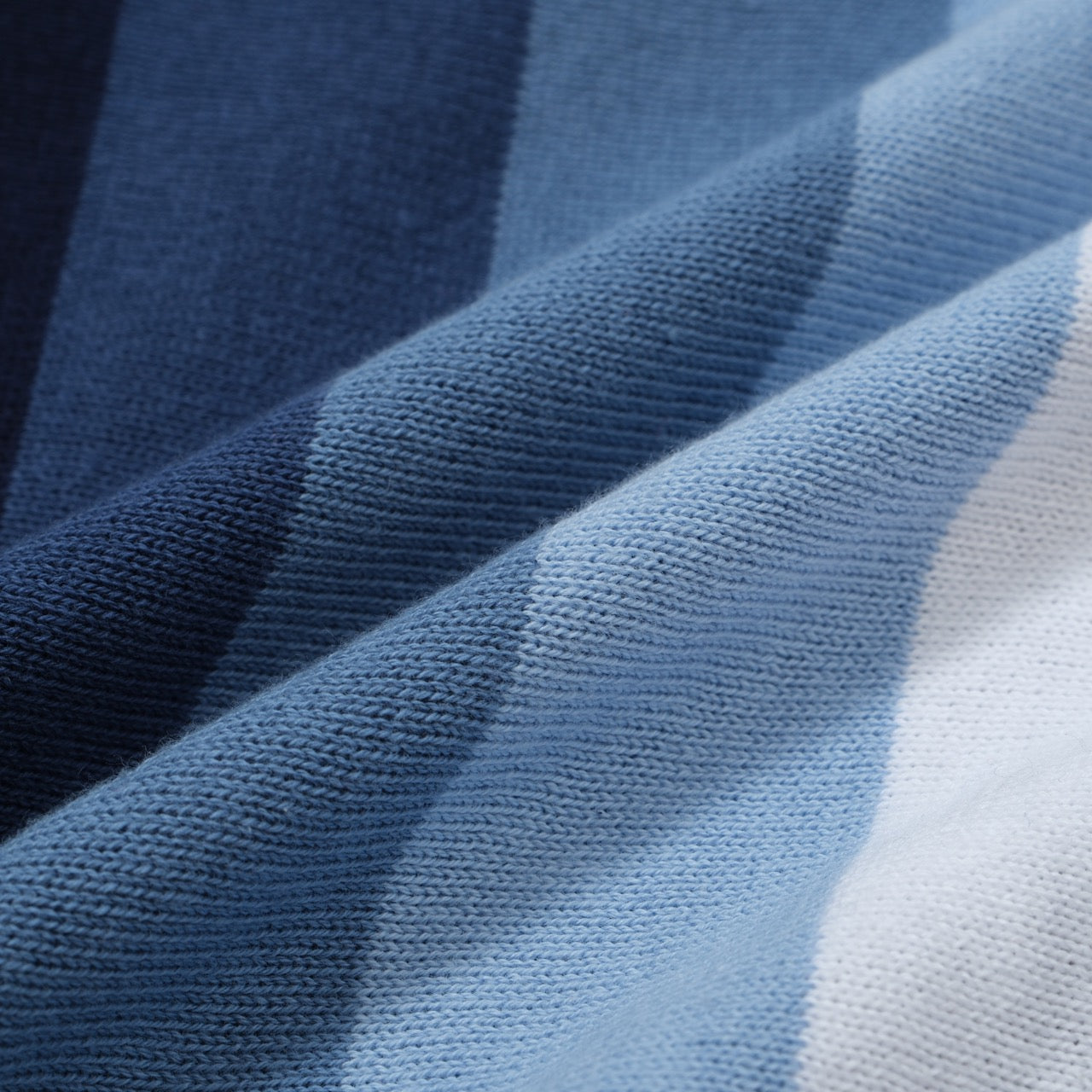 Navy and sky blue vertical stripe knit polo shirt by OXKNIT, featuring a classic button-up design for men.