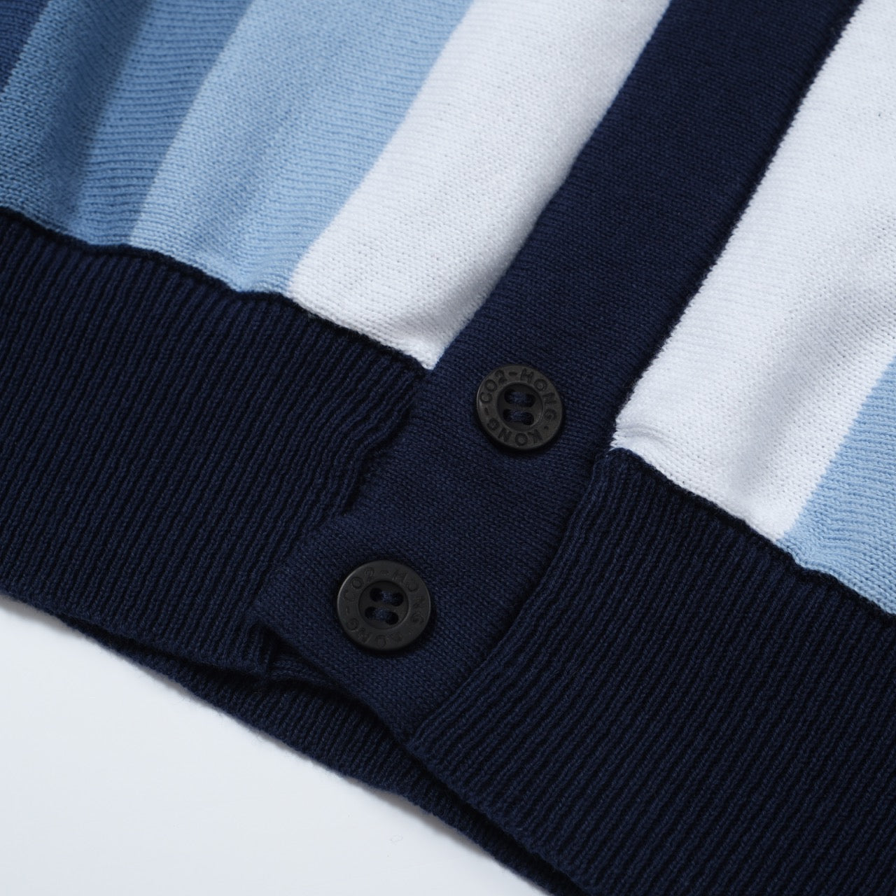 Men's OXKNIT navy and sky blue vertical stripe knit polo shirt with button-up detail, showcasing a vintage 60s style.