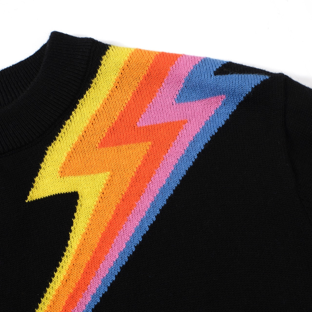 Women's black sweater featuring a lightning bolt design in retro 60s MOD style by OXKNIT, long sleeve knit top.